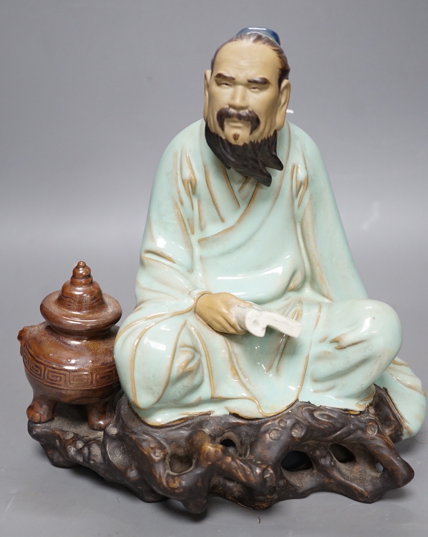 A Chinese Shiwan pottery figure